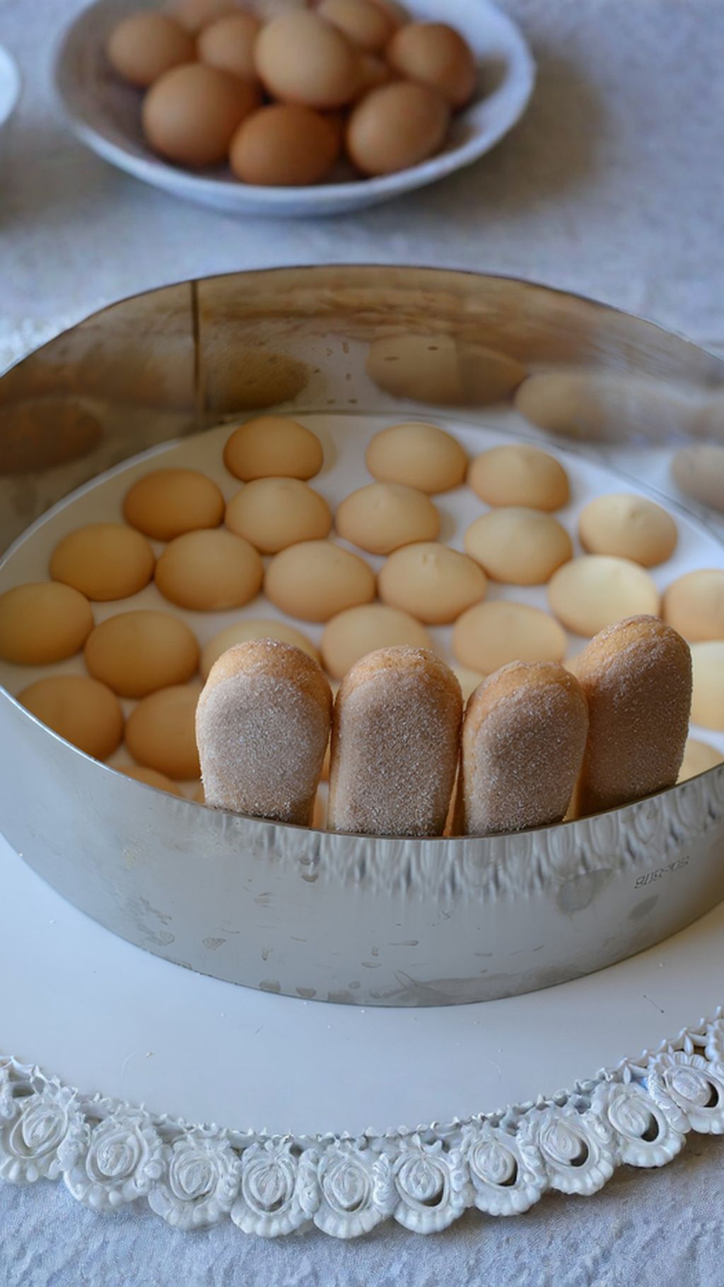 Line the tin with ladyfingers