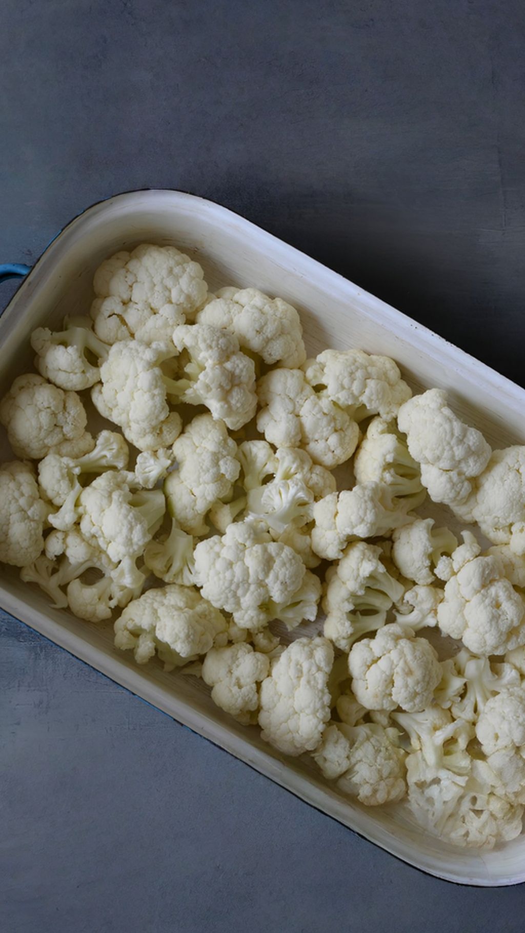 Prep the cauliflower and baking dish